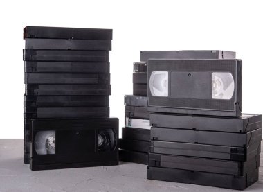 Many VHS video cassettes on the desk with isolated background clipart