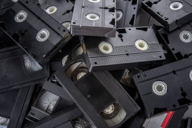Many VHS videocassettes on the table - top view