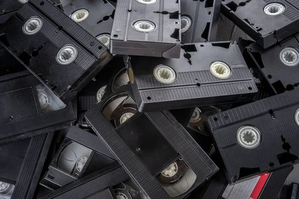 Many VHS videocassettes on the table - top view