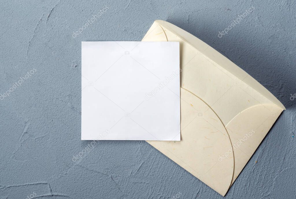 Blank letter and envelope on the table