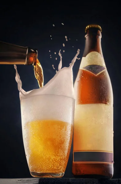 Beer is poured into a glass with a spray of foam