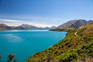 Beautiful landscape with high rocks with illuminated peaks, New Zealand.