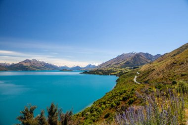 Beautiful landscape with high rocks with illuminated peaks, New Zealand.