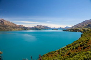 Beautiful landscape with high rocks with illuminated peaks, New Zealand.