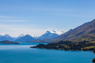 Beautiful landscape with high rocks with illuminated peaks, New Zealand.