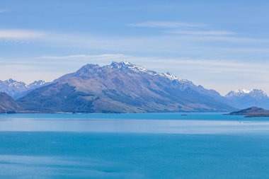 Beautiful landscape with high rocks with illuminated peaks, New Zealand.