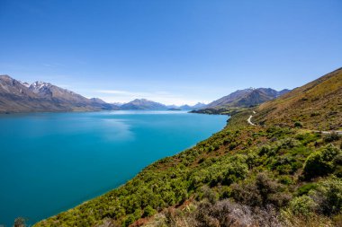 Beautiful landscape with high rocks with illuminated peaks, New Zealand.