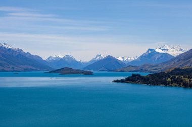 Beautiful landscape with high rocks with illuminated peaks, New Zealand.