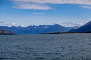 Beautiful landscape with high rocks with illuminated peaks, New Zealand.