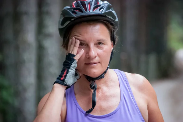 Close-up portrait of woman with cycling helmet