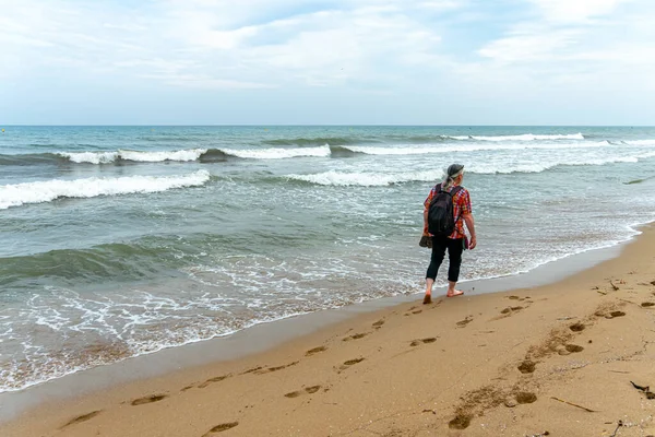 Man walking on a beach in Alicante. Spain