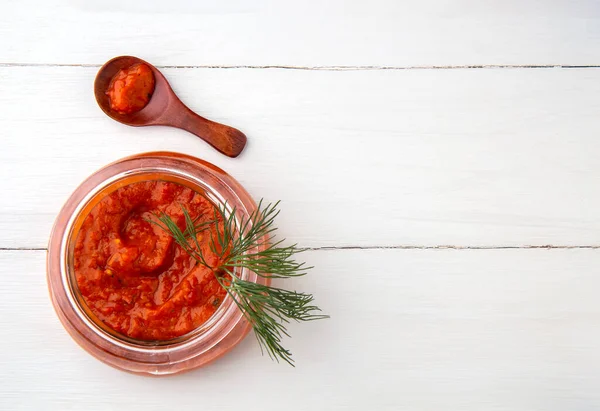 Balkan snack ajvar in a jar on a white background — Stock Photo, Image