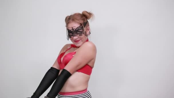 Surprised cheerful young woman in black gloves, looking camera, spreading hands — Stock Video