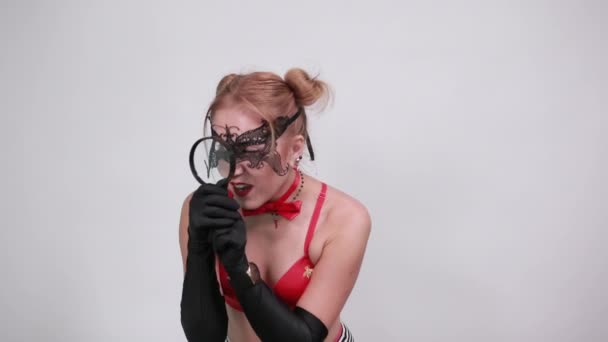 Portrait of young woman in red bra looking aside put hand prop up on chin — Stock Video