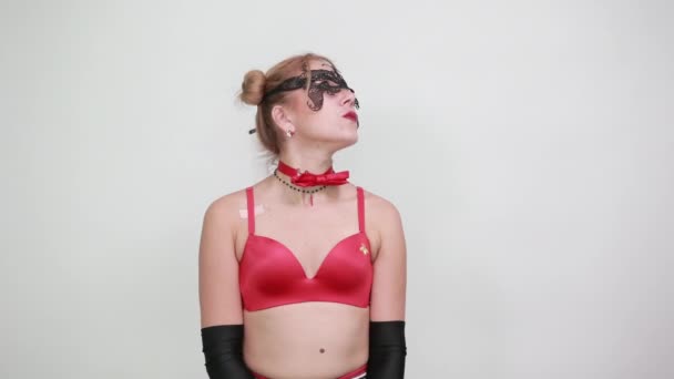 Stunning young woman in red bra standing, looking and pointing finger on camera — Stock Video