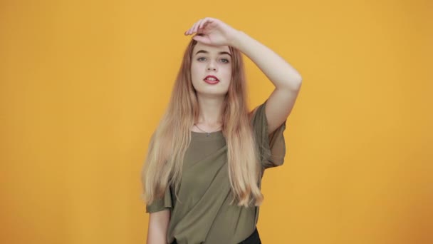 Pretty girl thinking about issue, looking tired, keeping hand on forehead — Stock Video