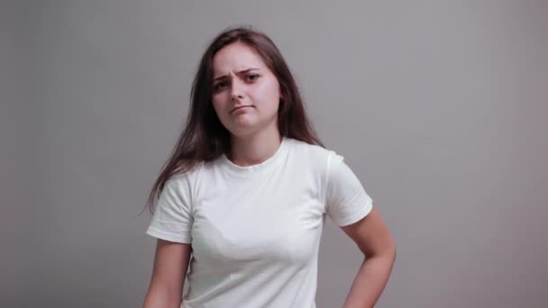 Charming brunette young woman in fashion white shirt keeping telephone, talking — 图库视频影像