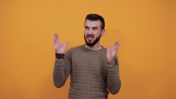 Shocked handsome man showing palms at camera, keeping mouth opened — Stock Video