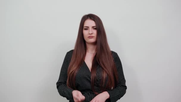 Disappointed caucasian woman over isolated gray wall keeping fist up, fight — Stock Video