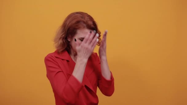 Tired caucasian young woman covering face with hand — Stock Video