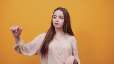 Disappointed woman keeping thumbs up and down, unhappy