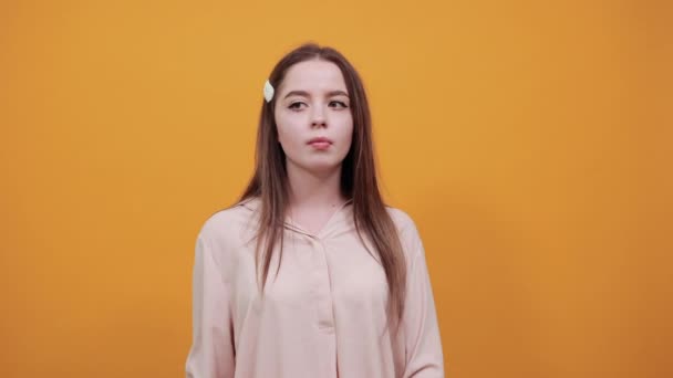 Bored caucasian woman keeping fist on cheek, loooking at camera, unhappy — 비디오