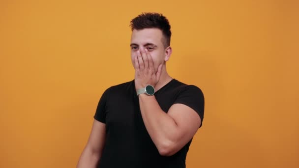 Handsome caucasian young man covered face with hands, unhappy. — Stok video