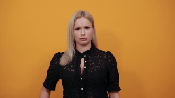 Girl in black dress an irritated woman shows off hands which symbolize the stop — Stock Video