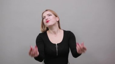 Young blonde girl in black jacket gleva woman asks for repentance