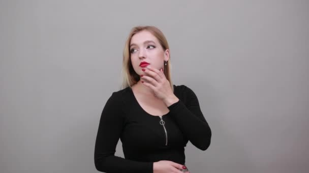 Young blonde girl in black jacket cute woman gently strokes face with hand — Stok video