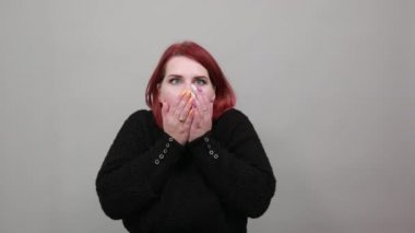 fat lady in black sweater shocked woman covered her mouth with hands in surprise