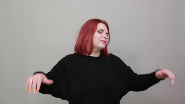 Redhead fat lady in black sweater happy woman raises her hands in delight smiles — 图库视频影像