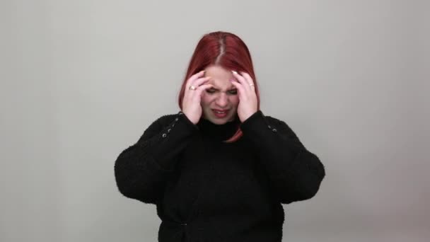 Disappointed woman in despair holding her hair with hands in a bad mood — Stock video