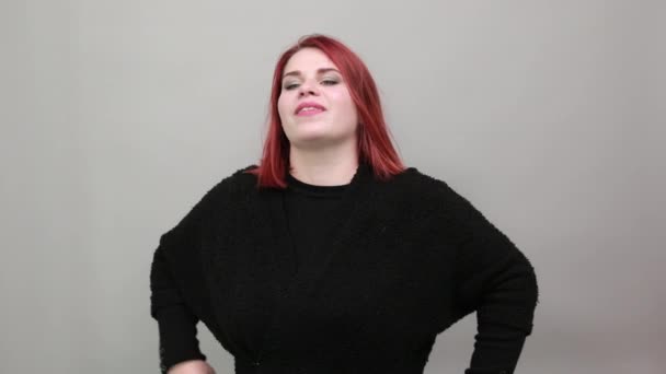 Fat lady in black sweater happy woman smiles, covers her mouth with hand, smiles — Wideo stockowe