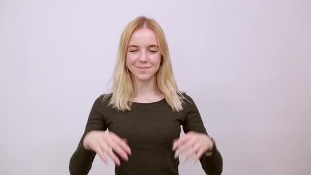 Cute Girl Touches Her Face With Hands, Looks At Camera. The Concept Of Tender — Stock Video