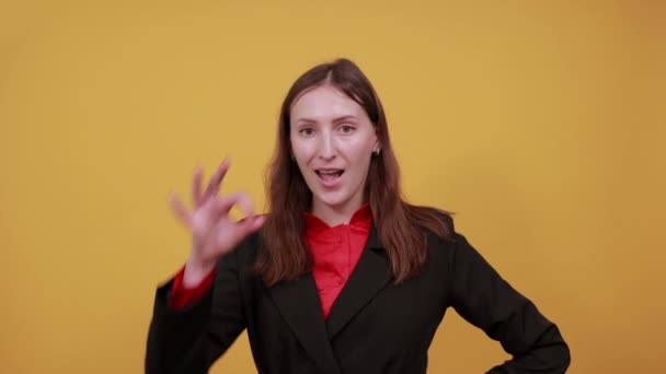 Cheerful Woman Holds Fingers To Eye As A Sign That Everything Is Ok With Her. — Stock Video