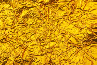 Buruşmuş sarı folyonun dokusu.