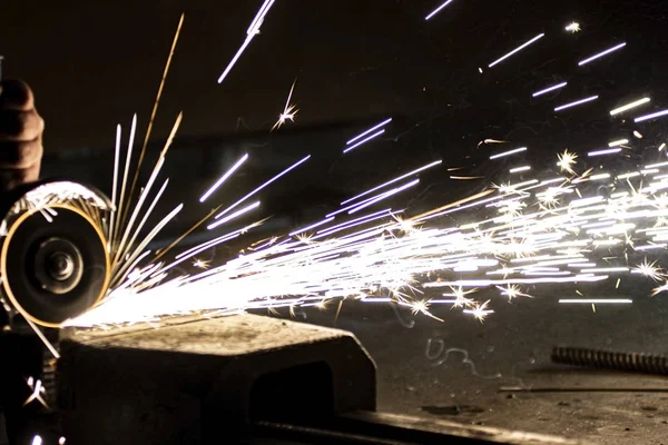 Metal processing using an abrasive wheel.