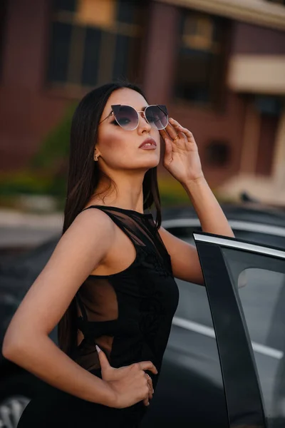 Stylish Young Girl Stands Car Black Dress Business Fashion Style — Stock Photo, Image