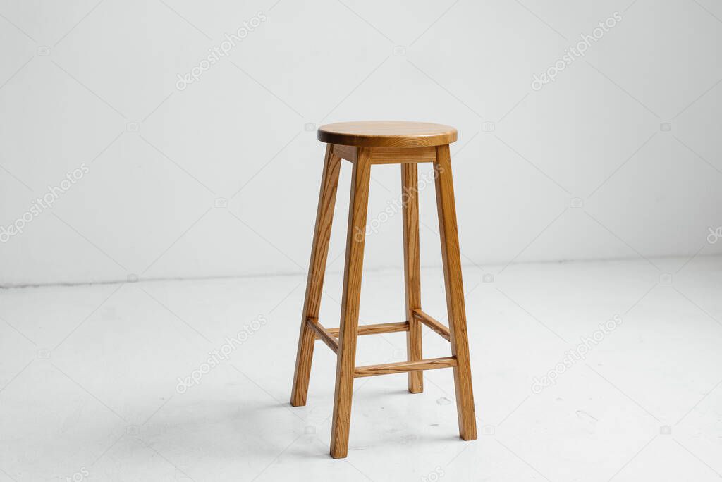 Wooden chair in a white empty room