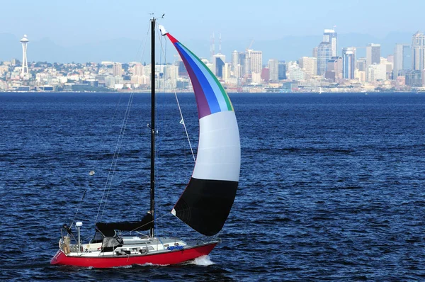 Sail Boat In Front Of The Waterfront Skyline Of Seattle