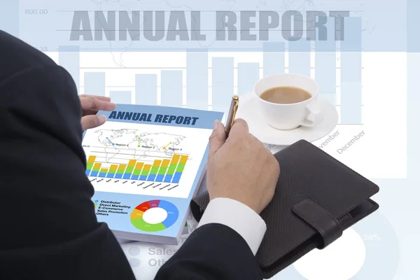 Annual report reviewed by businessman. — Stock Photo, Image