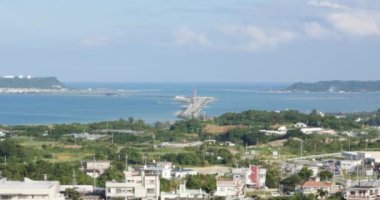 View of Kaichu Road to Yonashiro yahira, Uruma, Okinawa, Japan. The city covers part of the east coast of the south of Okinawa Island, the Katsuren Peninsula, and the eight Yokatsu Islands.