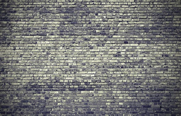 La pared está hecha de ladrillos. La textura de la pared . Fotos De Stock
