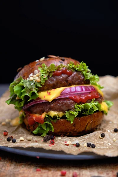 Tasty grilled double burger cheeseburger with pepper and salad