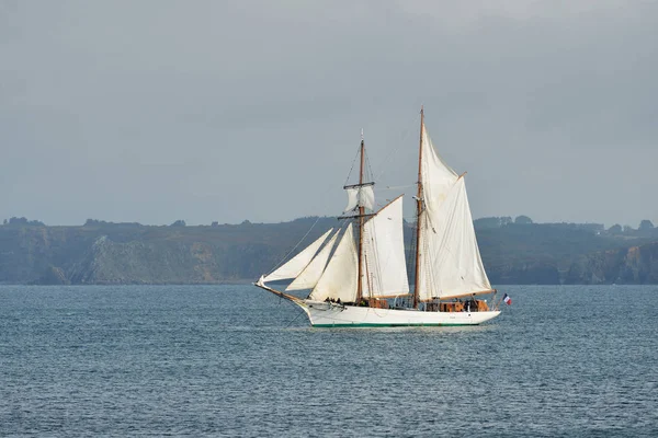 tall ship with full sails at the coast
