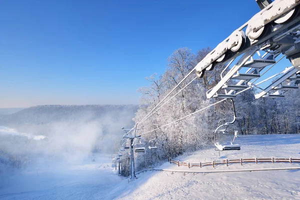 Chair lift for skiing covered in snow — Stock Photo, Image