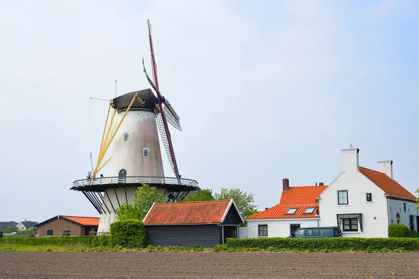 Classical Dutch landscape with a windmill on a field — Stock Photo, Image