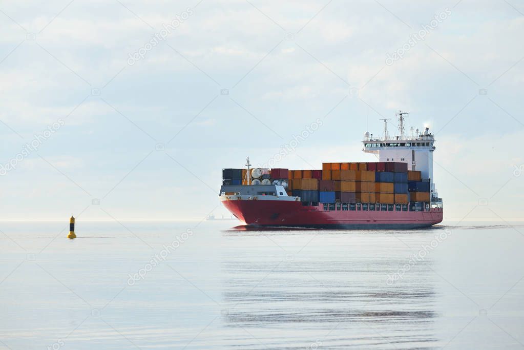 container ship sailing in sea water