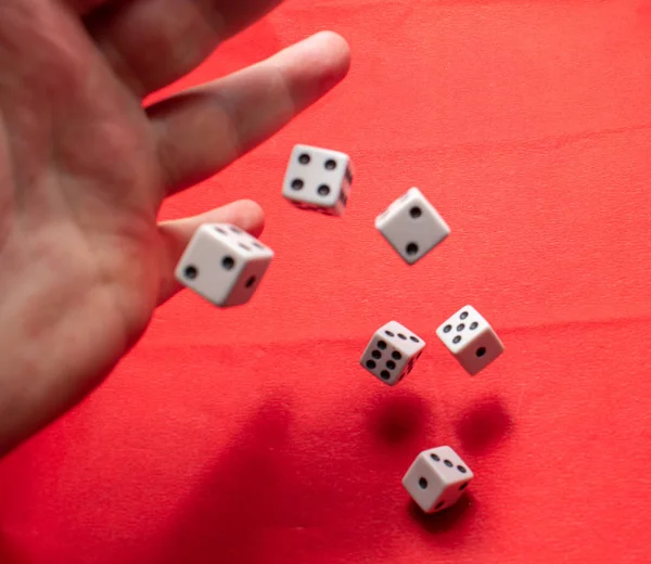Hand Throwing Dice Hoping Best Odds Six Dice Red Background 스톡 사진